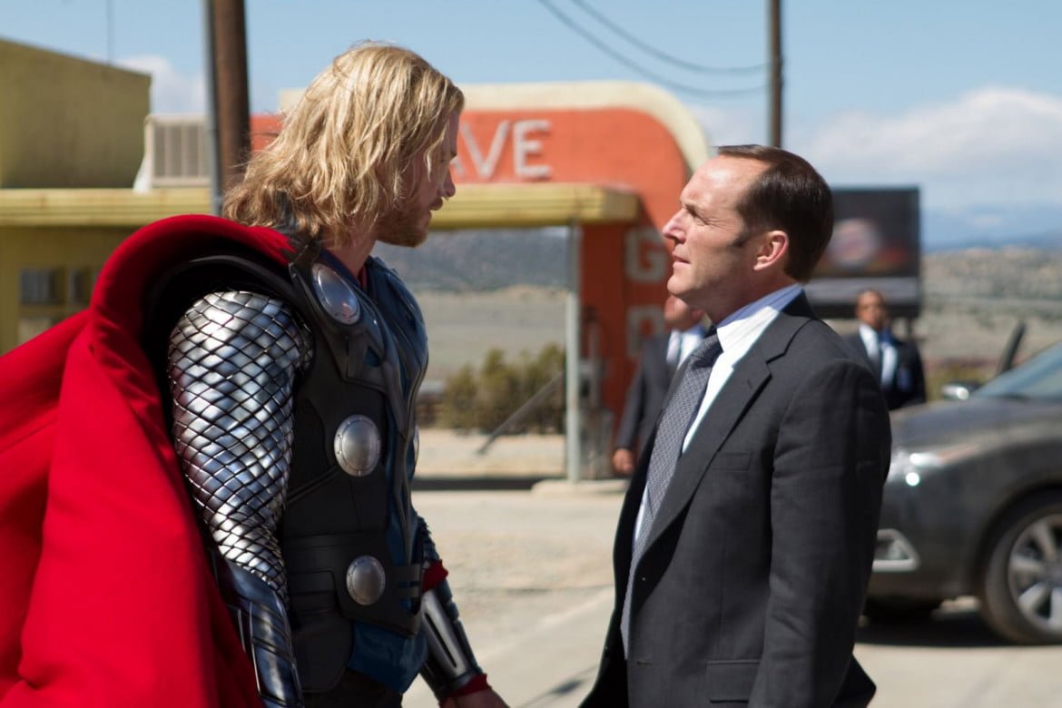 Chris Hemsworth as Thor opposite Clark Gregg as Agent Coulson